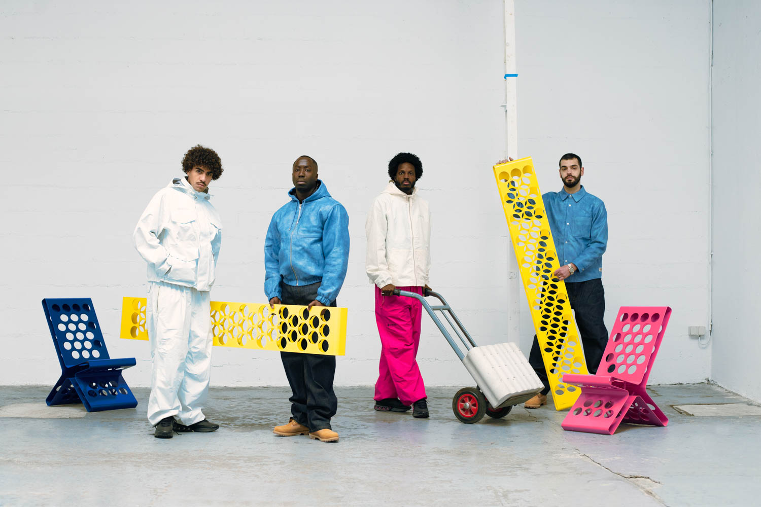 Portrait of multiple people holding yellow brackets