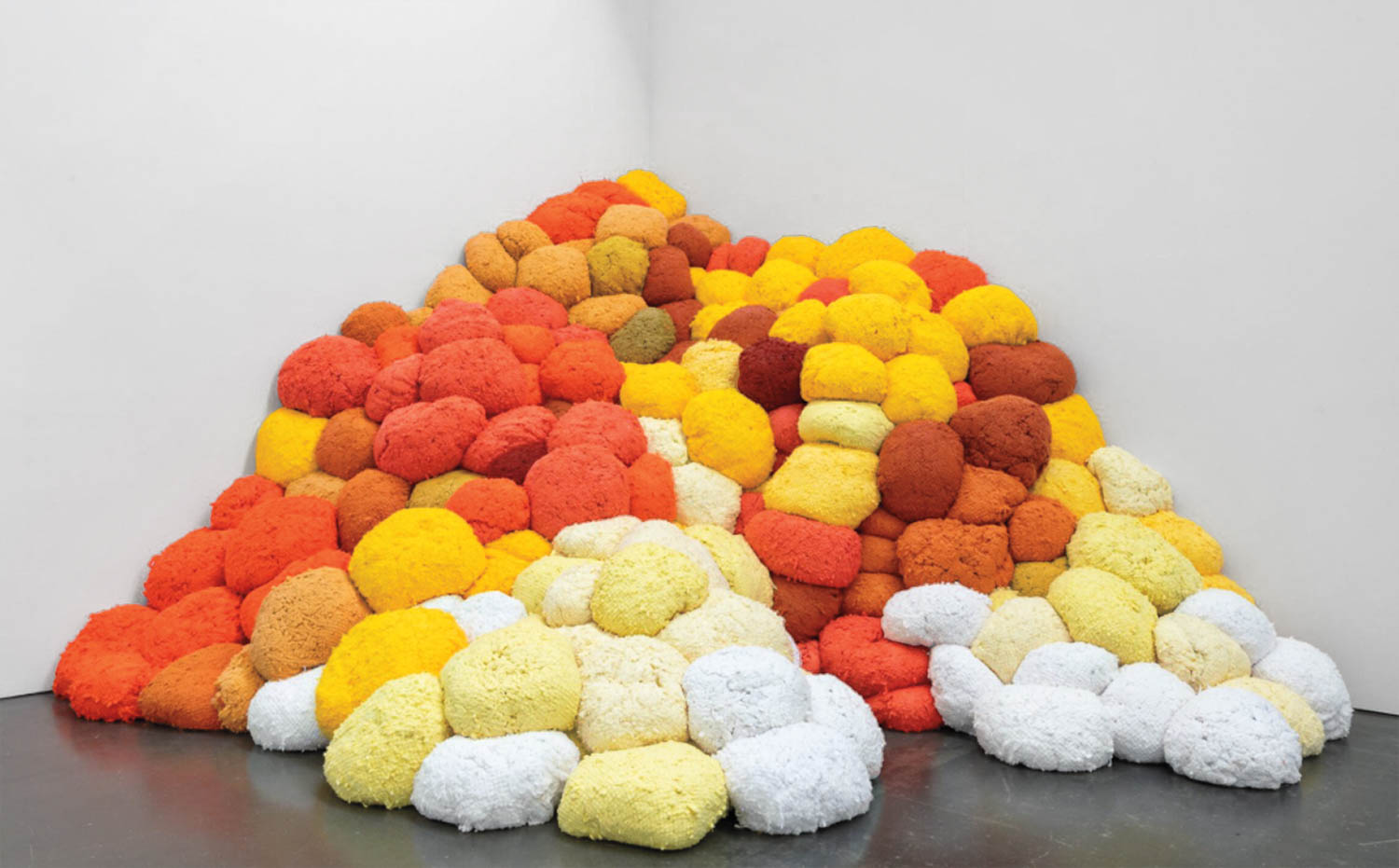 multiple piles of colorful fabric