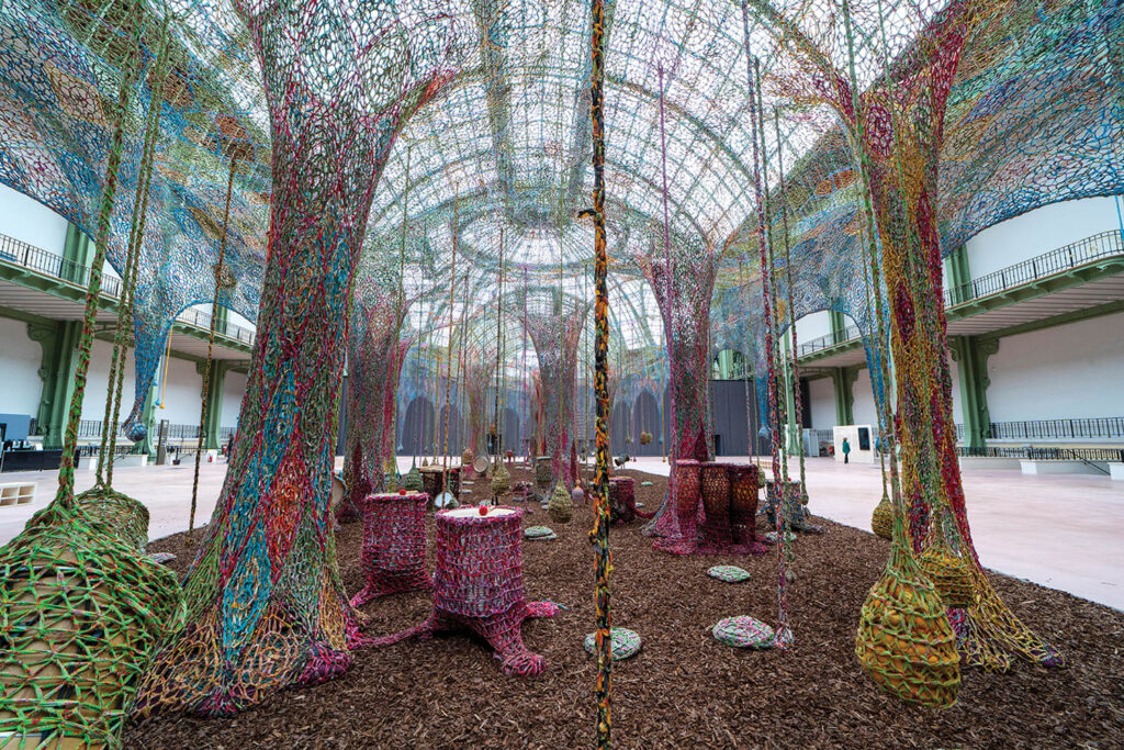 netted sculpture in room with glass ceiling