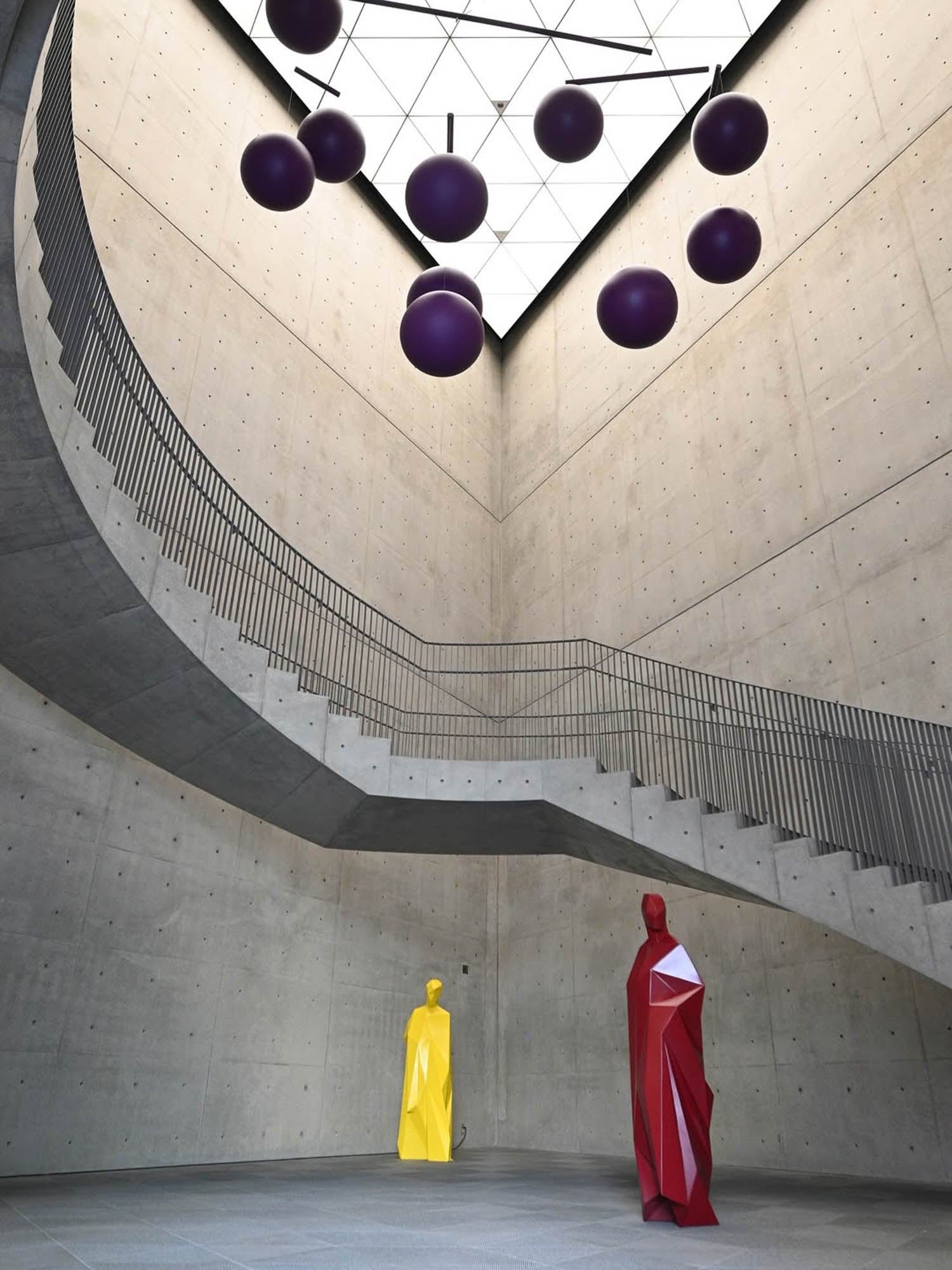 sculptures at the bottom of the staircase