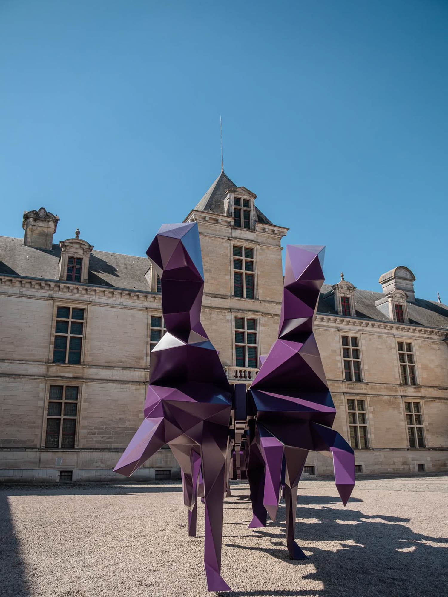 purple sculptures outside