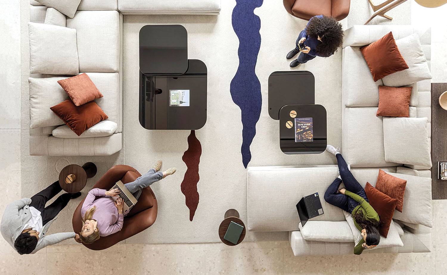 A group of people sitting on couches in a living room.