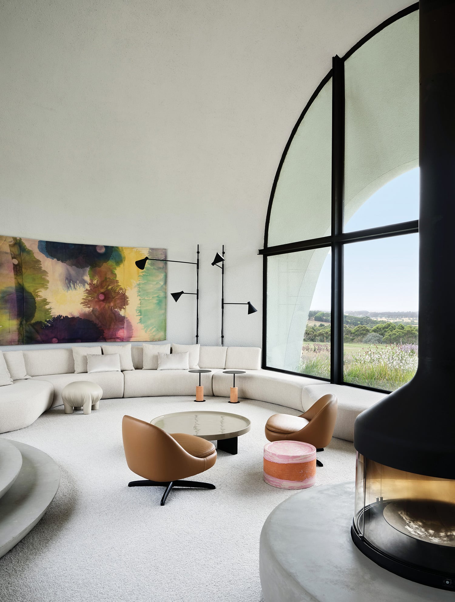 A living room with a large painting on the wall