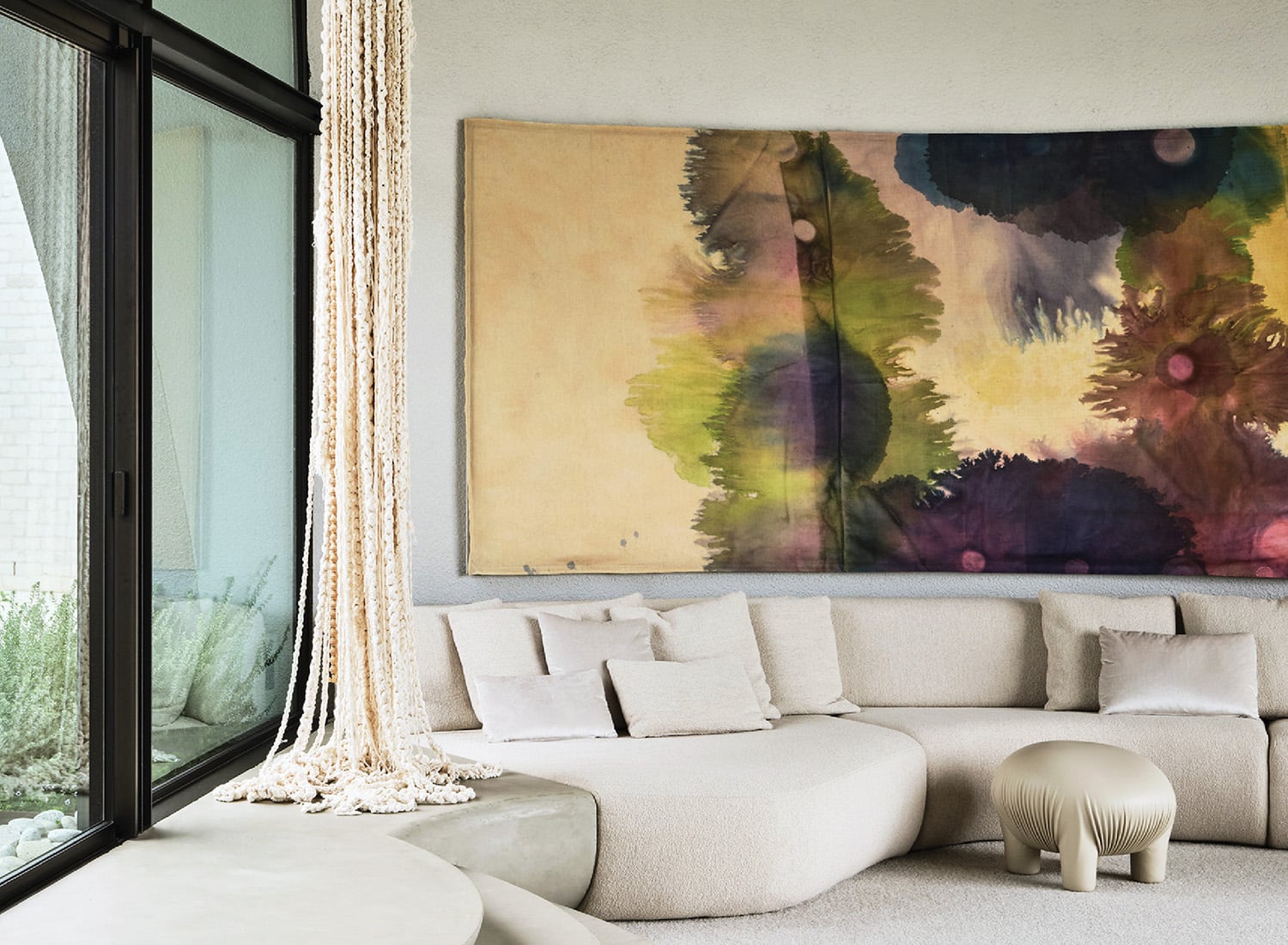 A large painting on a wall in a living room