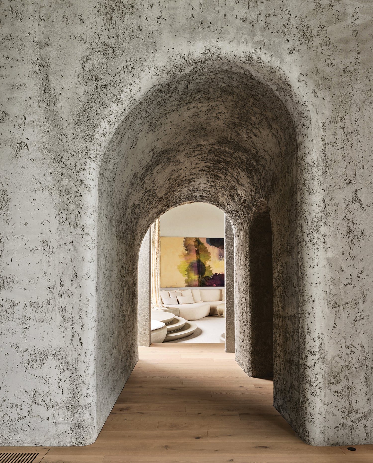 A long hallway with a toilet and a toilet in the middle