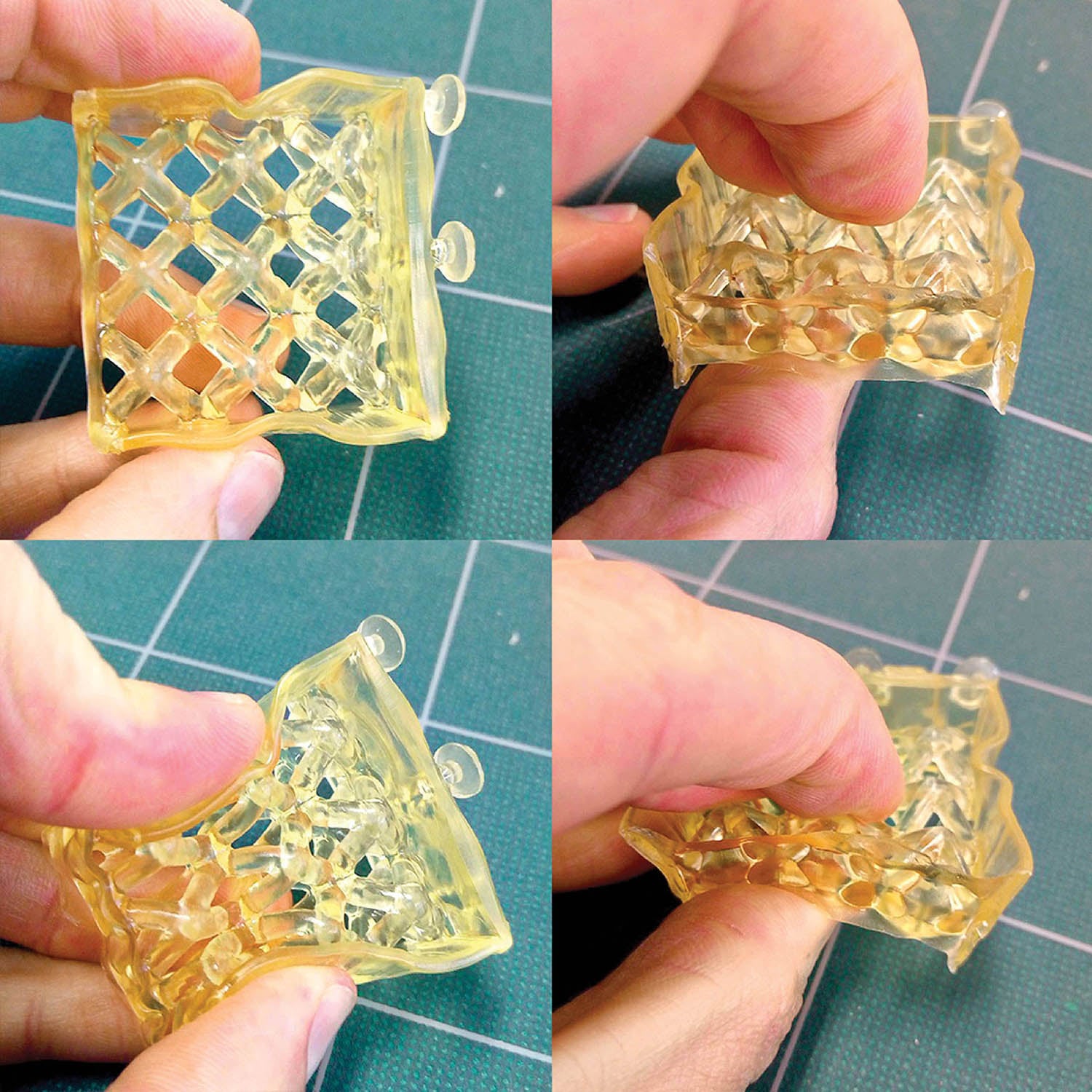 A hand holding a small piece of glass.