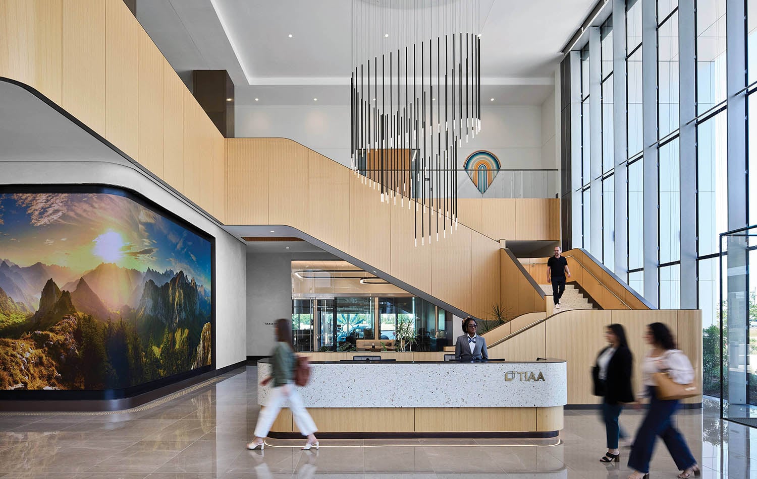 A lobby with a large screen on the wall.