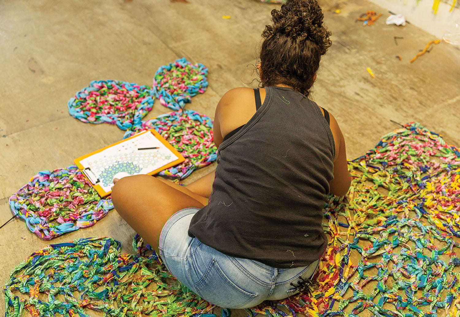 A woman sitting on the floor.