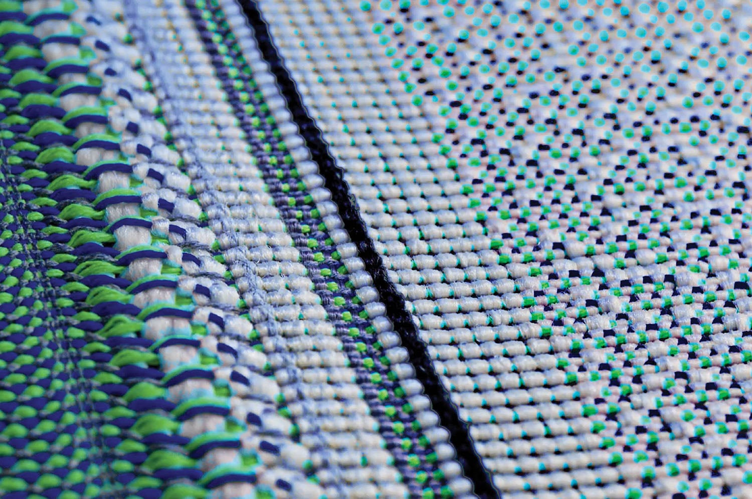 A close up of a green and white fabric.