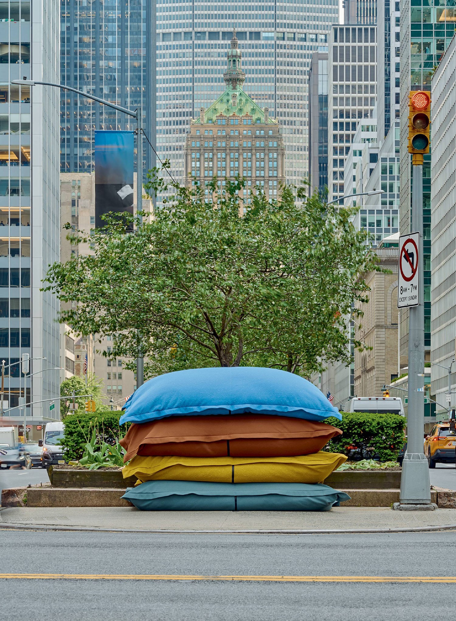 A tree with a blue and yellow pillow on it.