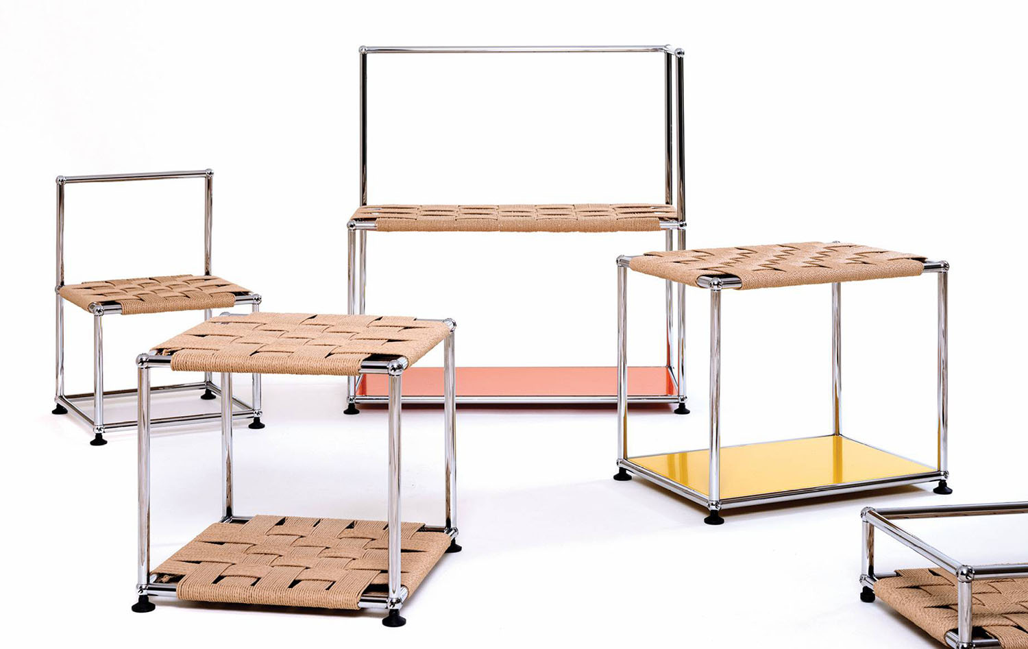 A set of three tables with a wooden top and metal legs.