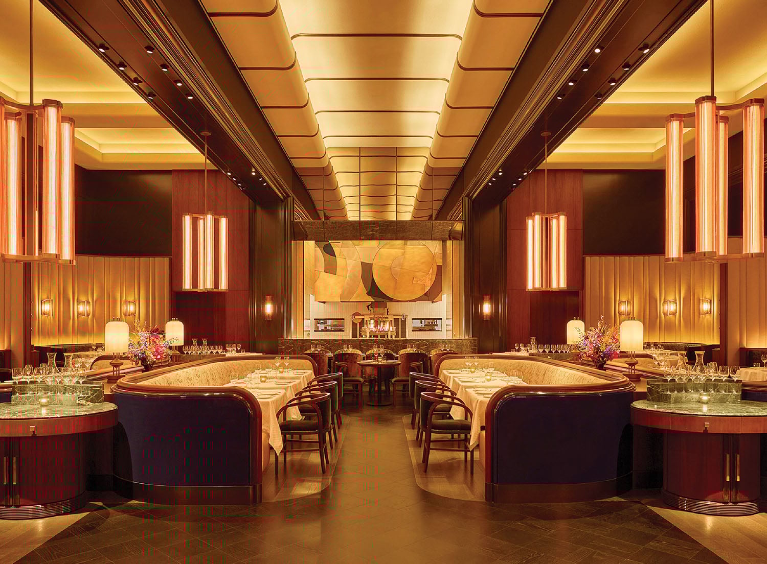 A restaurant with a large dining area with tables and chairs.