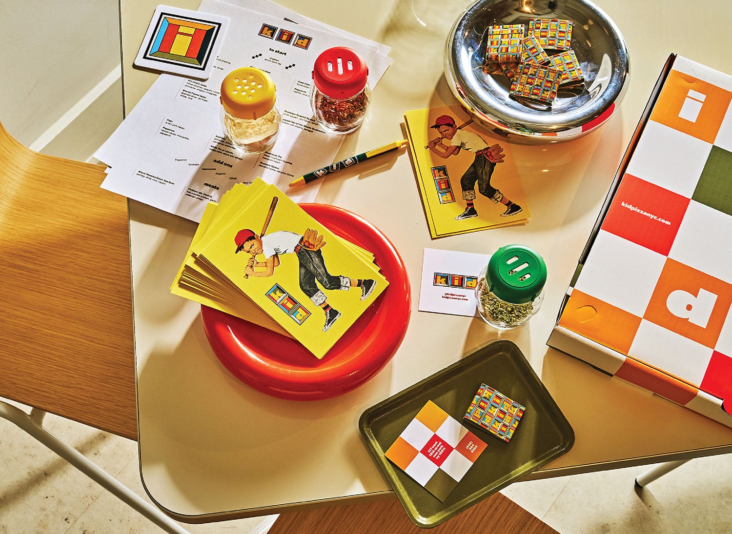 A table with a bowl of cereal and a plate of cereal.