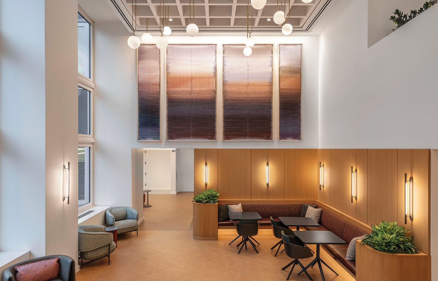 A large painting hangs above the reception area.