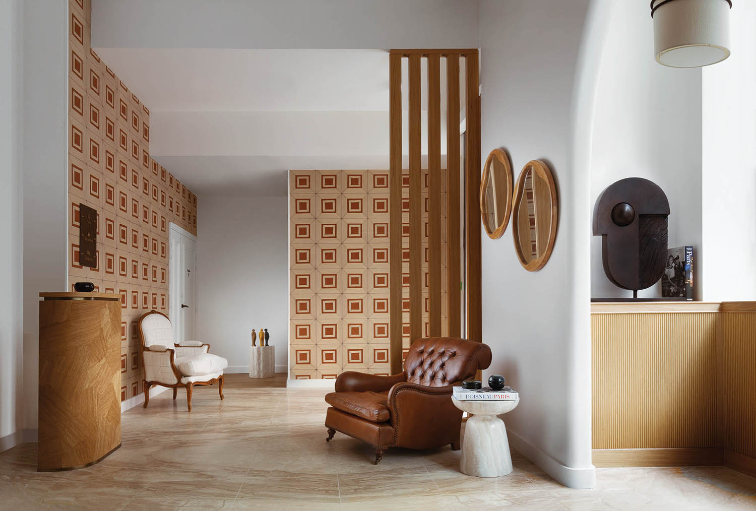 A living room with a couch and a chair.