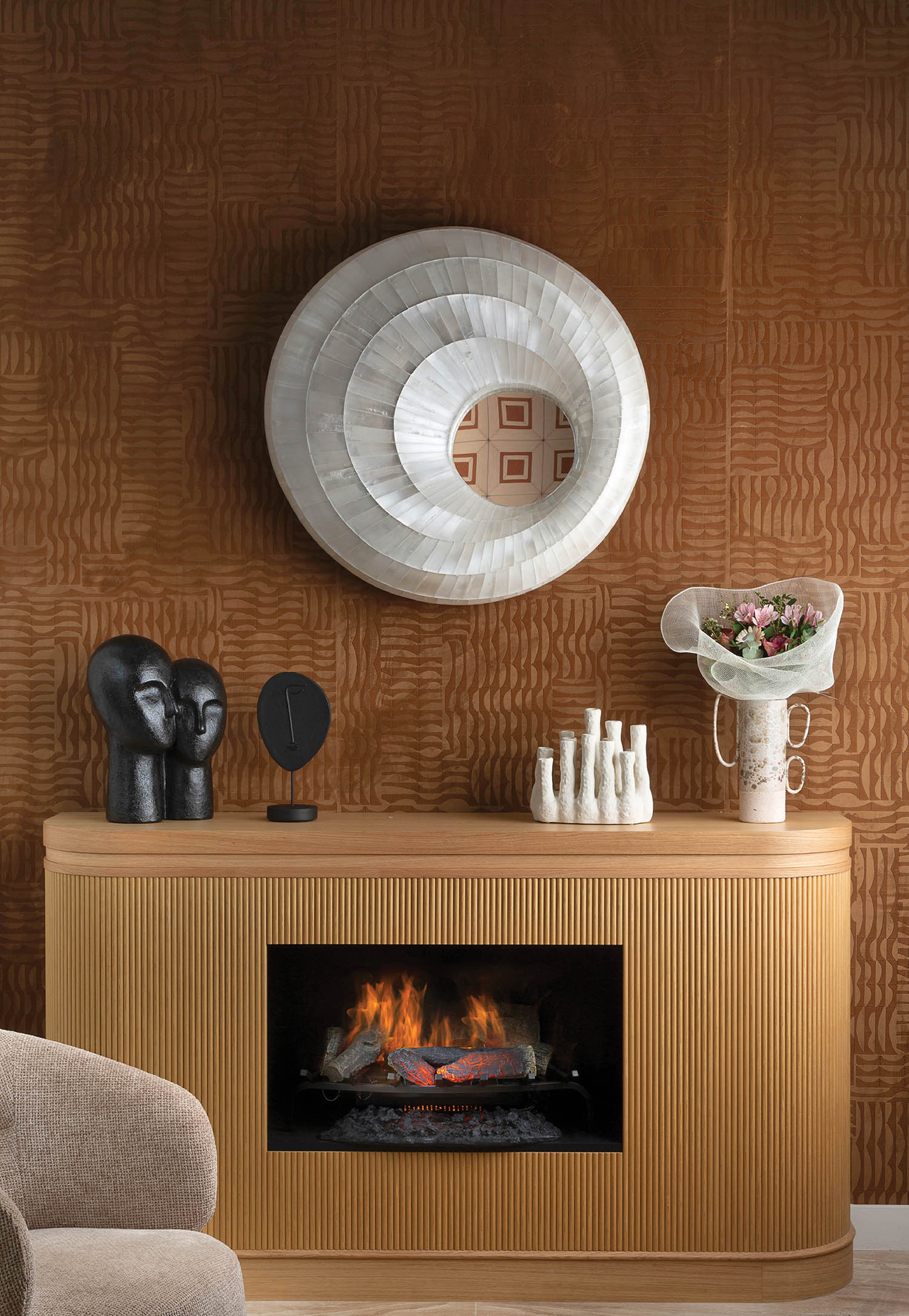 A fireplace with a mirror above it.