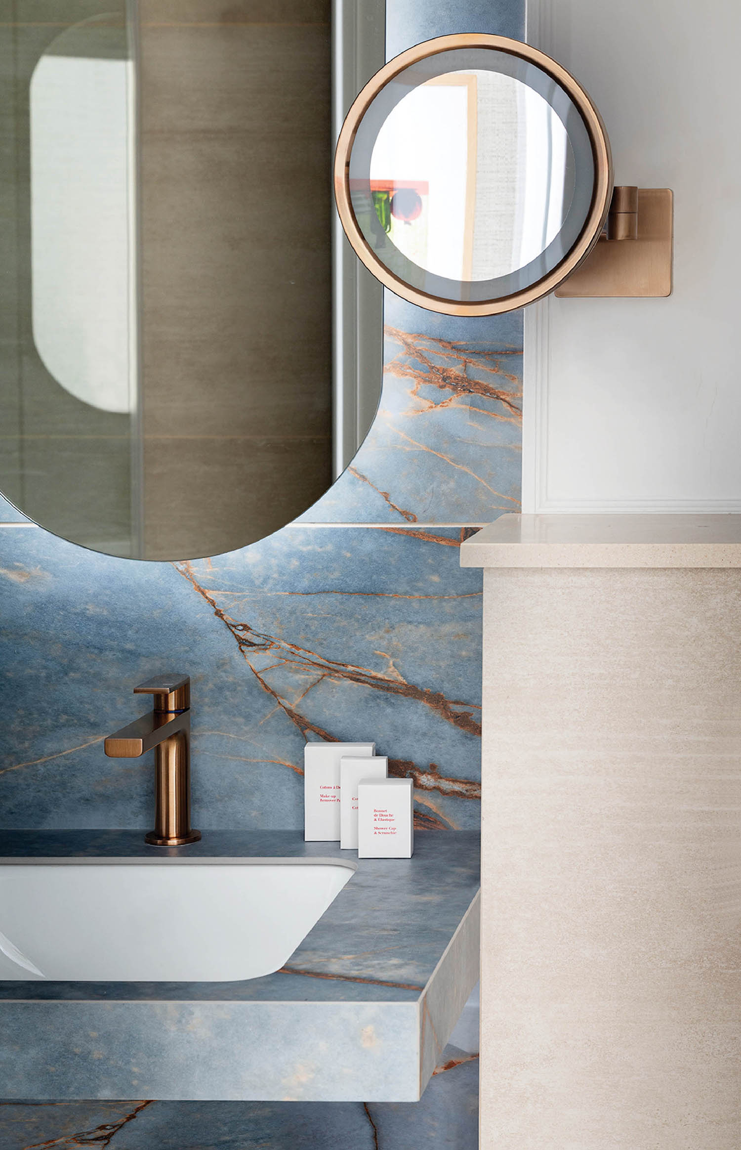 A bathroom with a sink and a mirror.