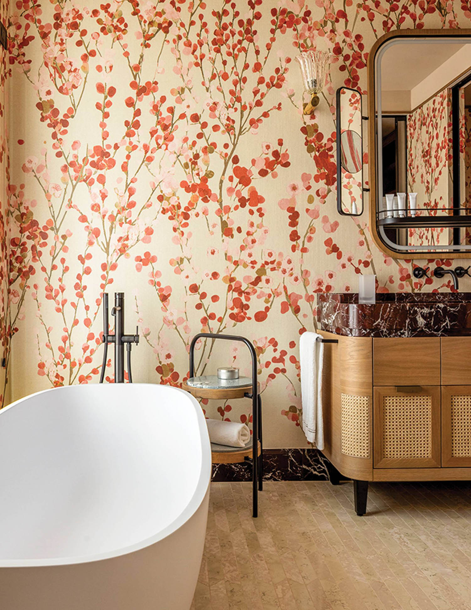 A bathroom with a large tub and a large mirror.