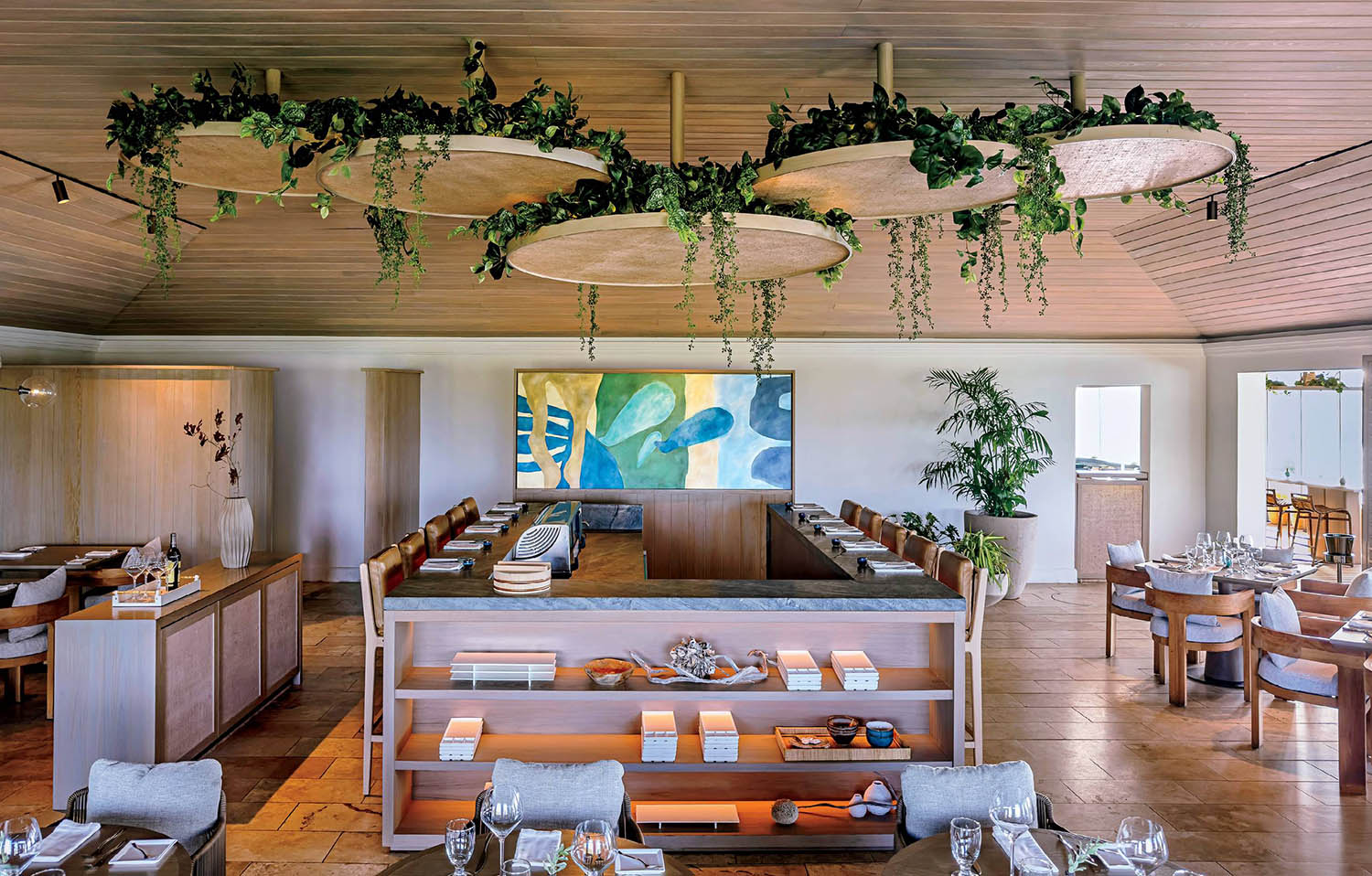 A restaurant with a large screen on the wall.