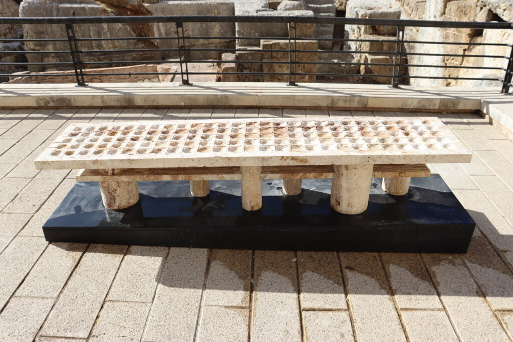 a bench with a pattern impressed into the top