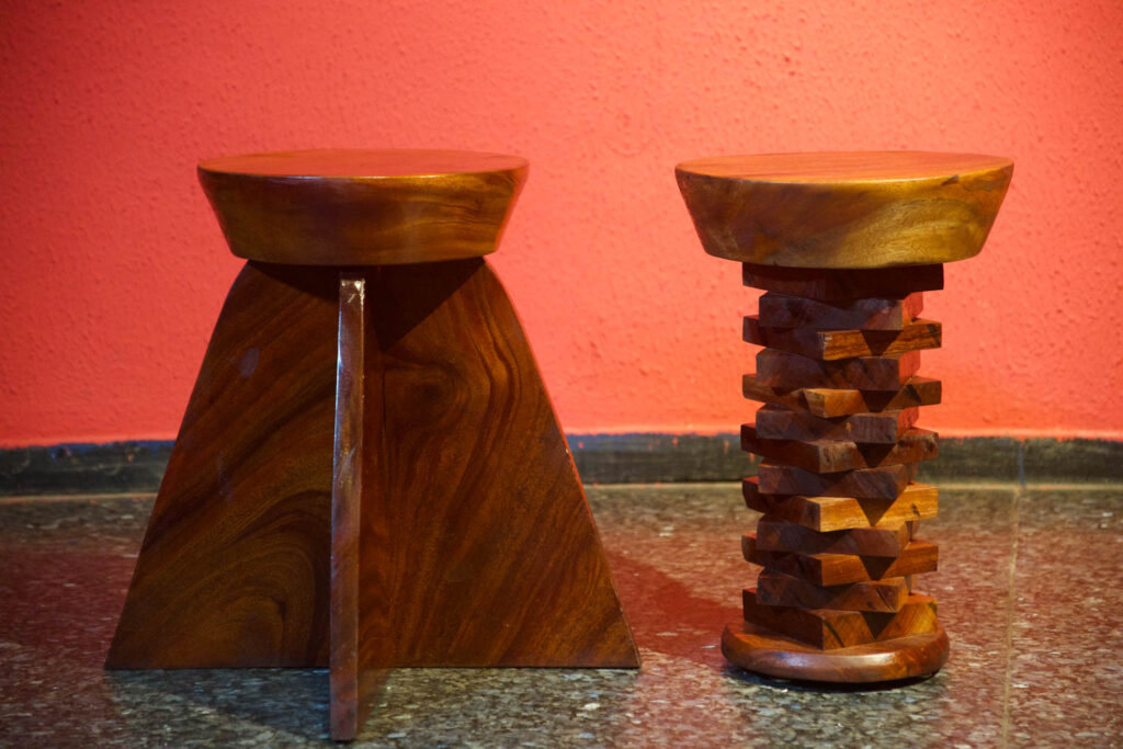 wooden stools in the middle of a room