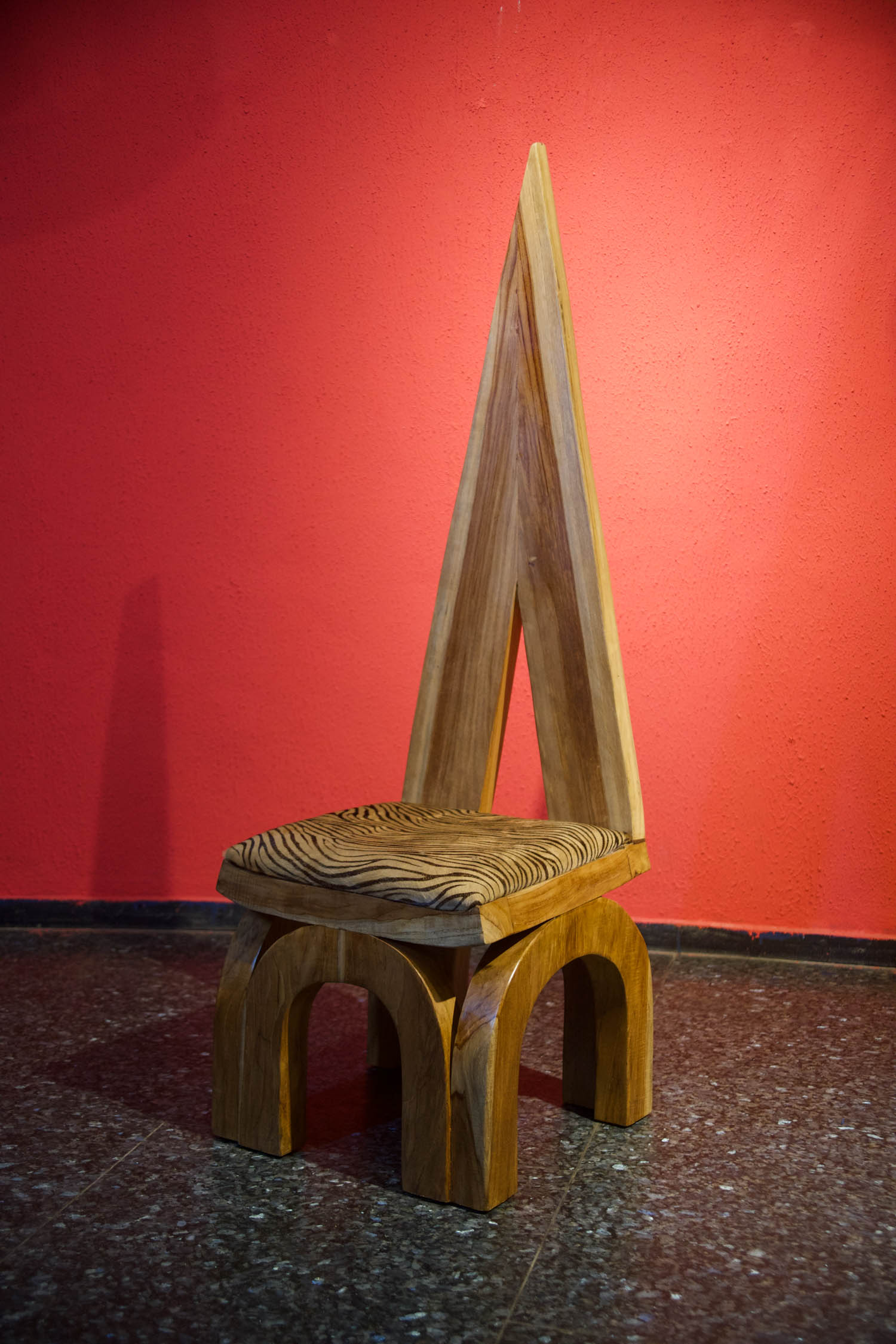 wooden chair with a pointy back