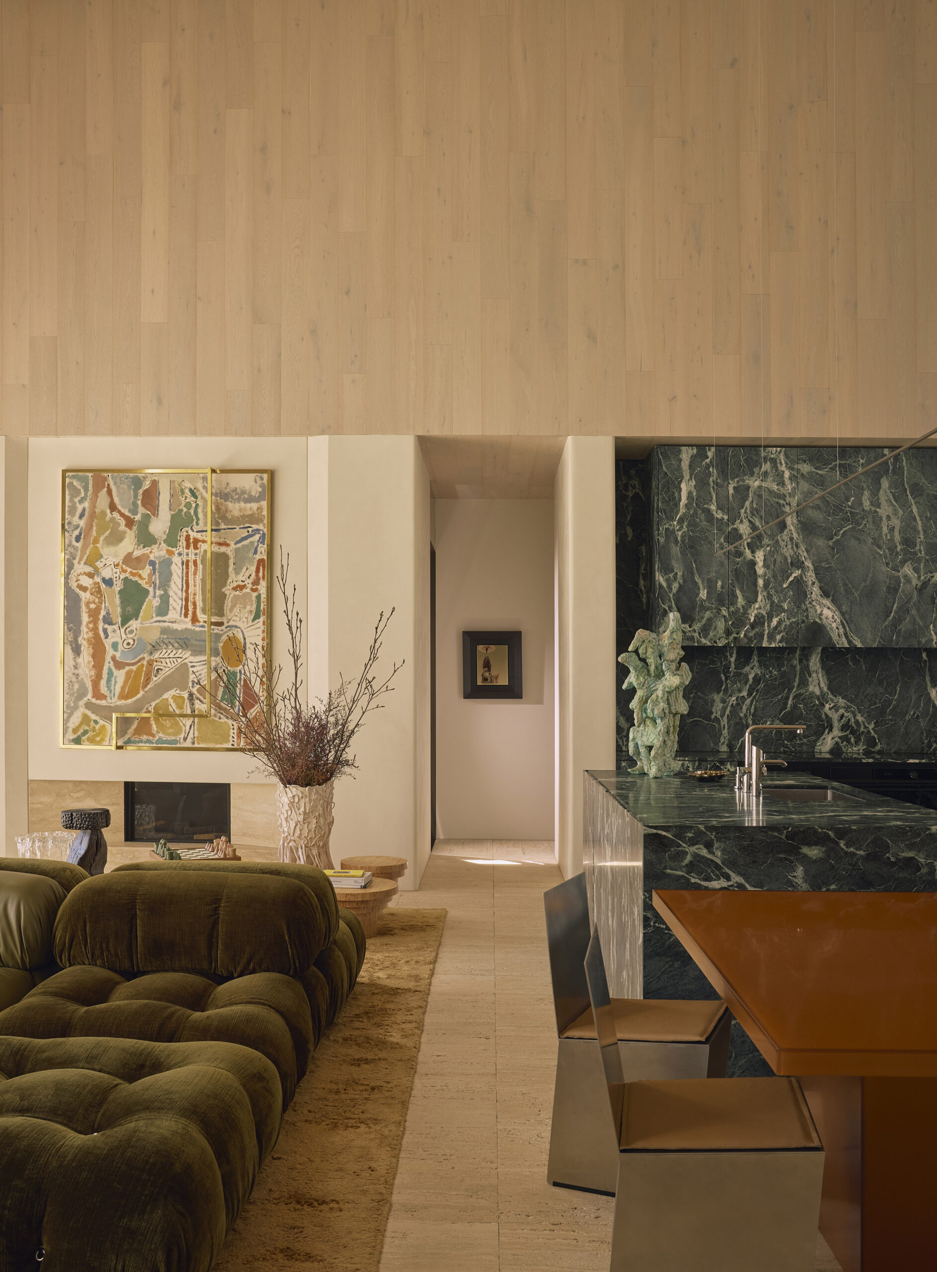 living room with green couch and seating