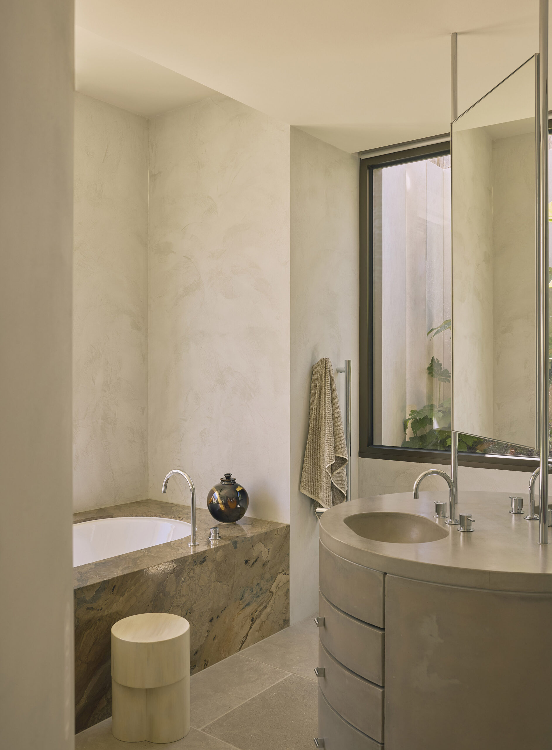 master ensuite bathroom with cylindrical vanity