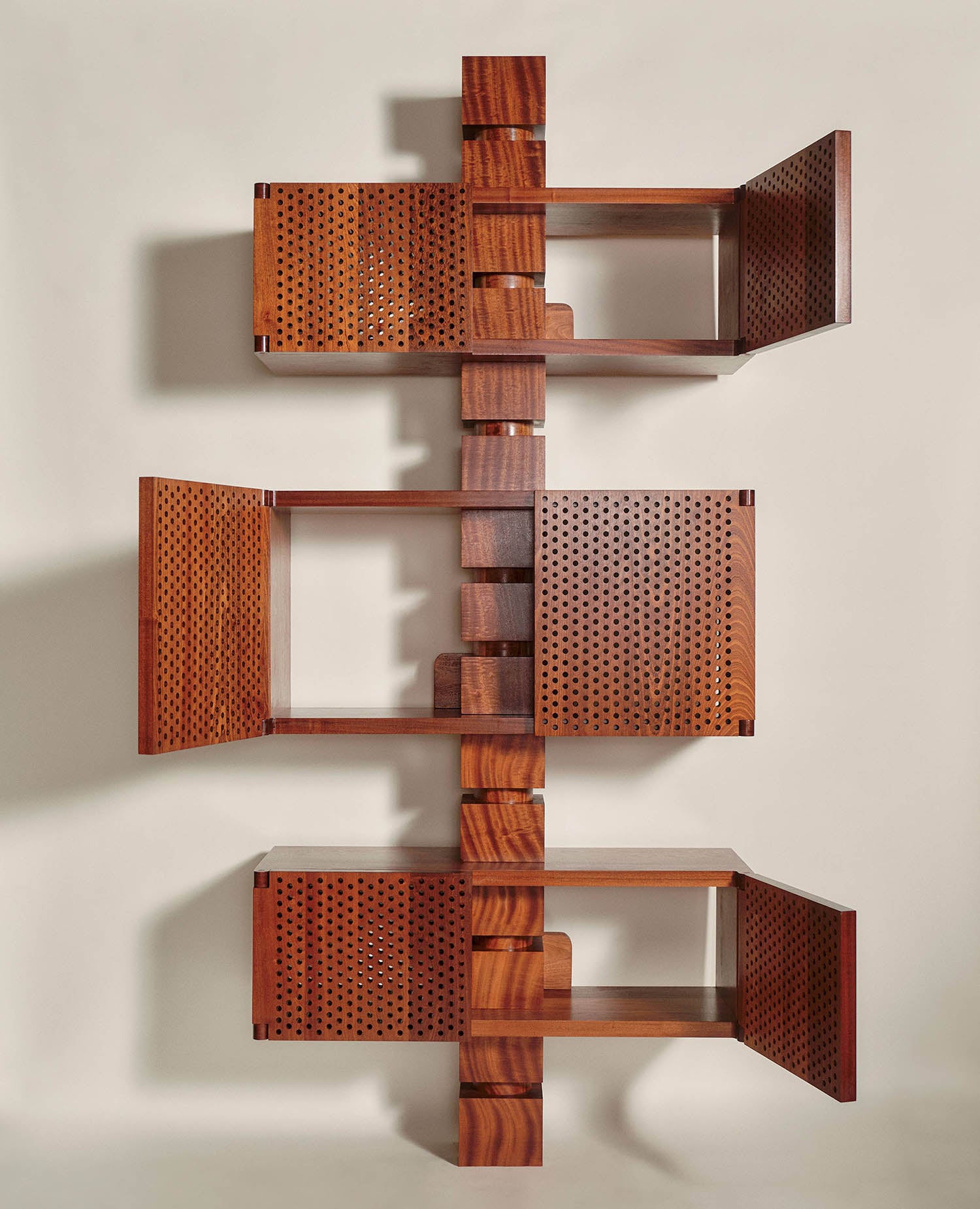 A wooden shelf with a metal grid on top.