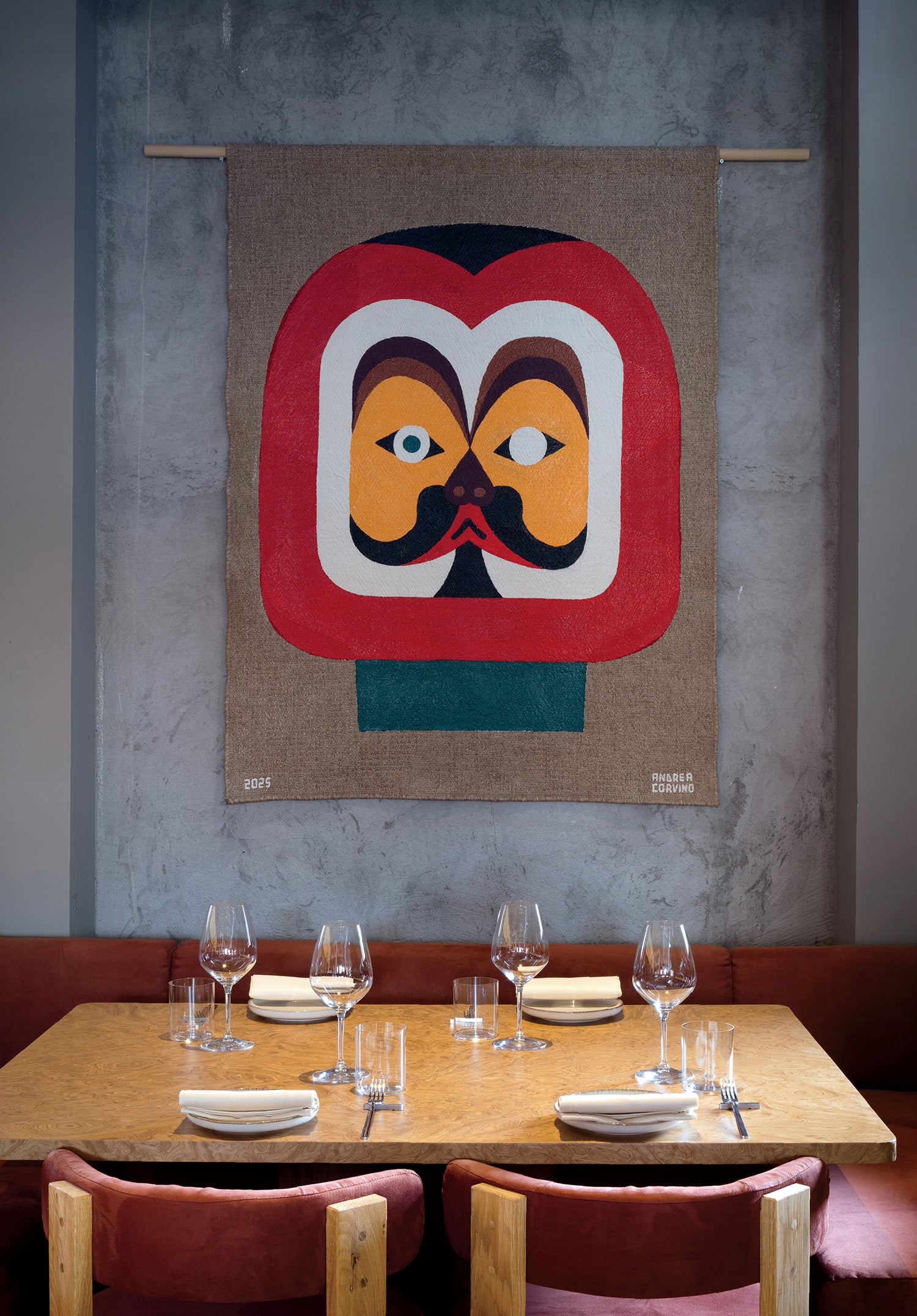 A painting of a man ' s face on a wall