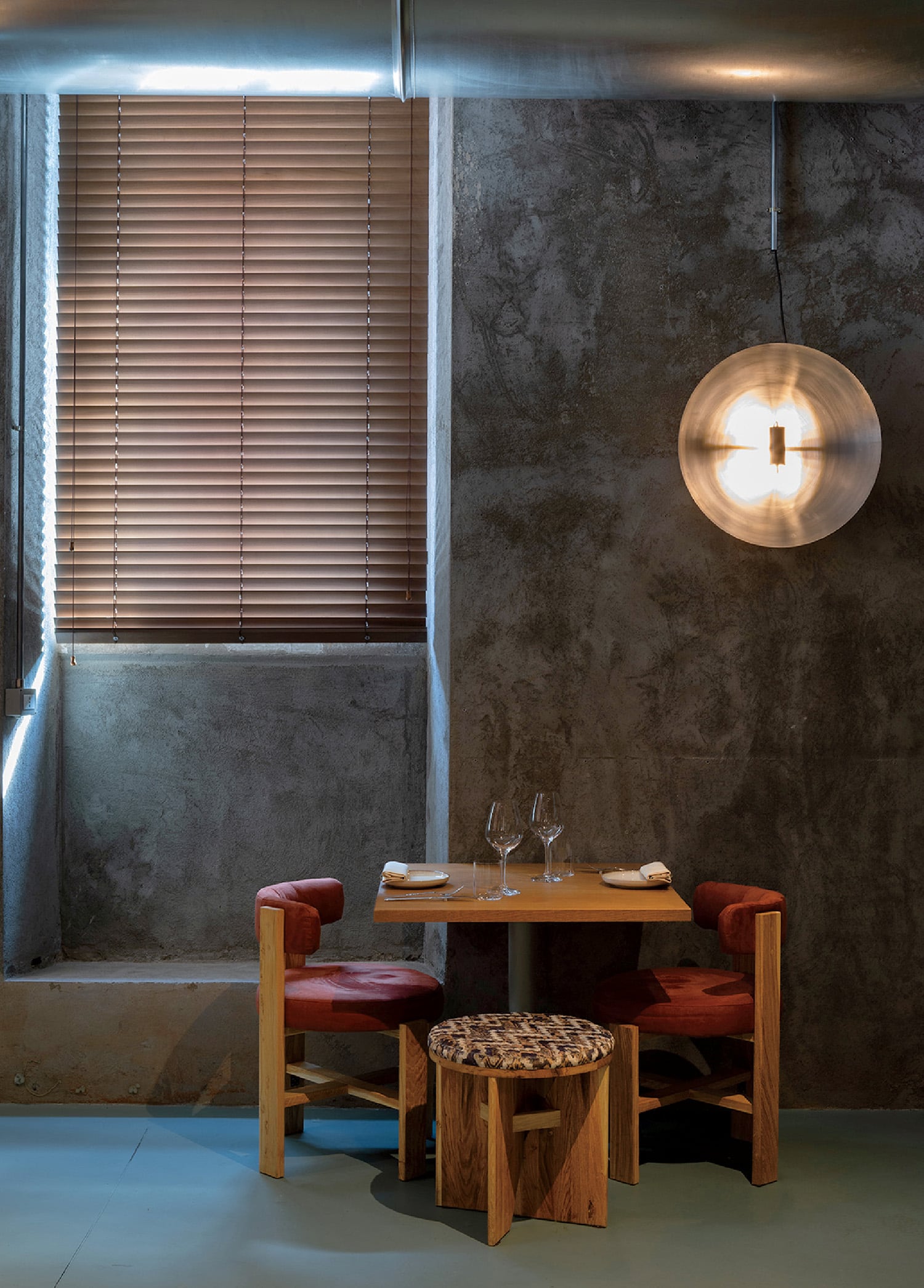 A table and two chairs in a room