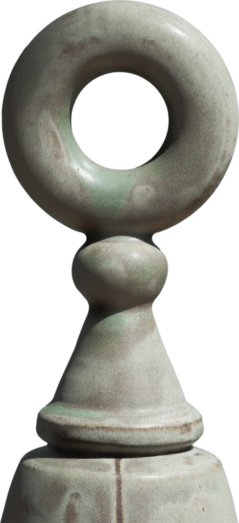 A large green vase with a circular design