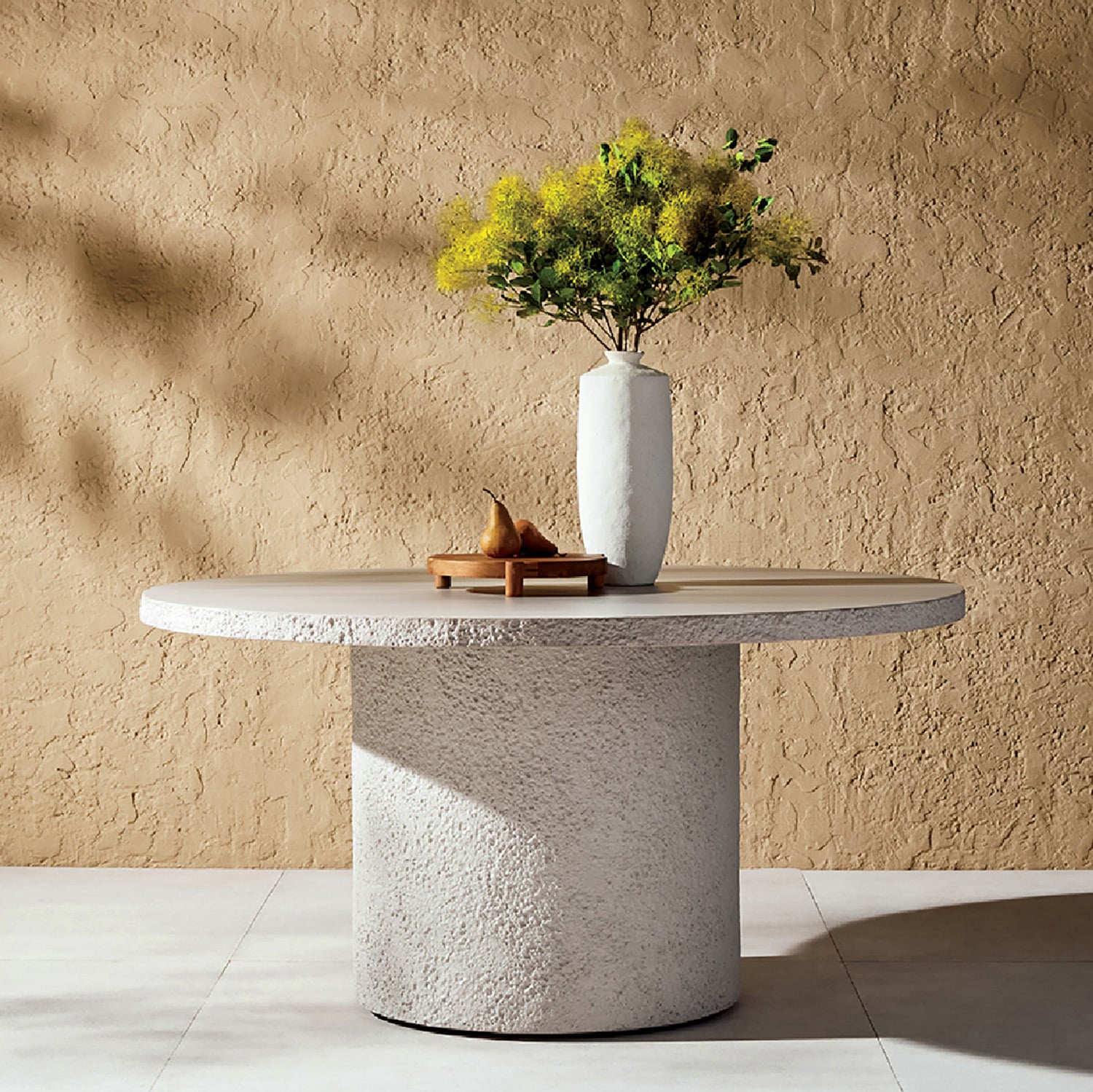 A vase with a flower on a table