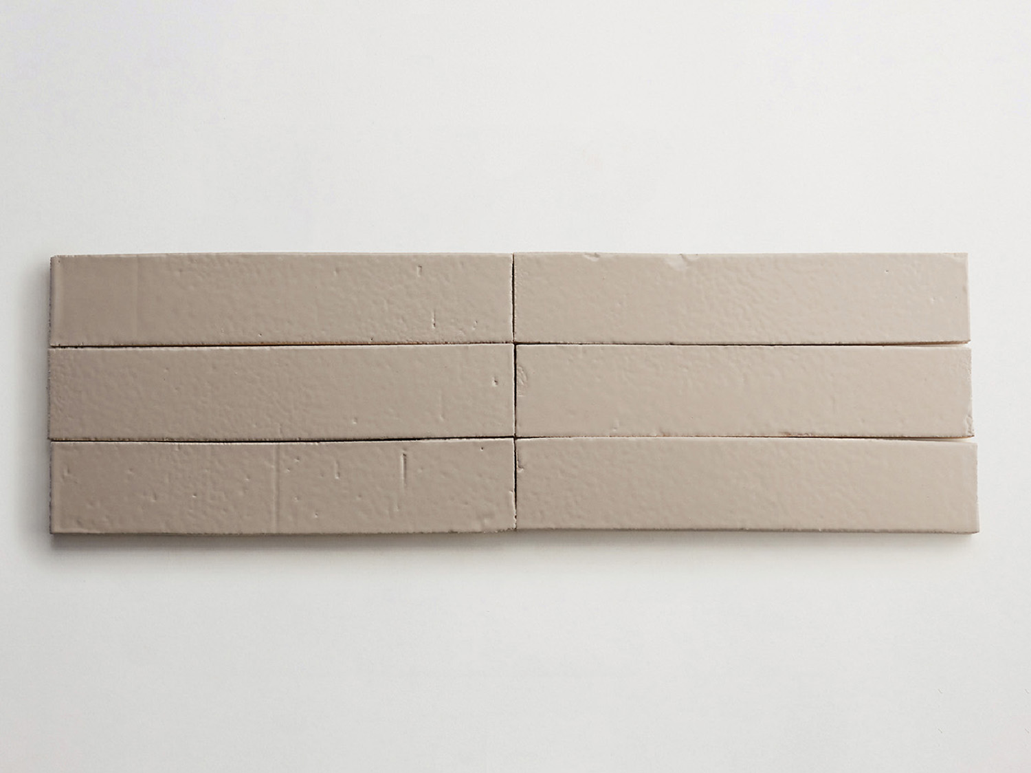 A piece of white paper with a small piece of brown paper