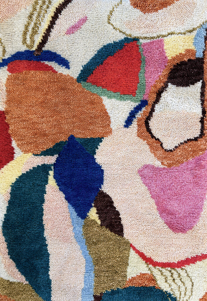 A rug with colorful shapes
