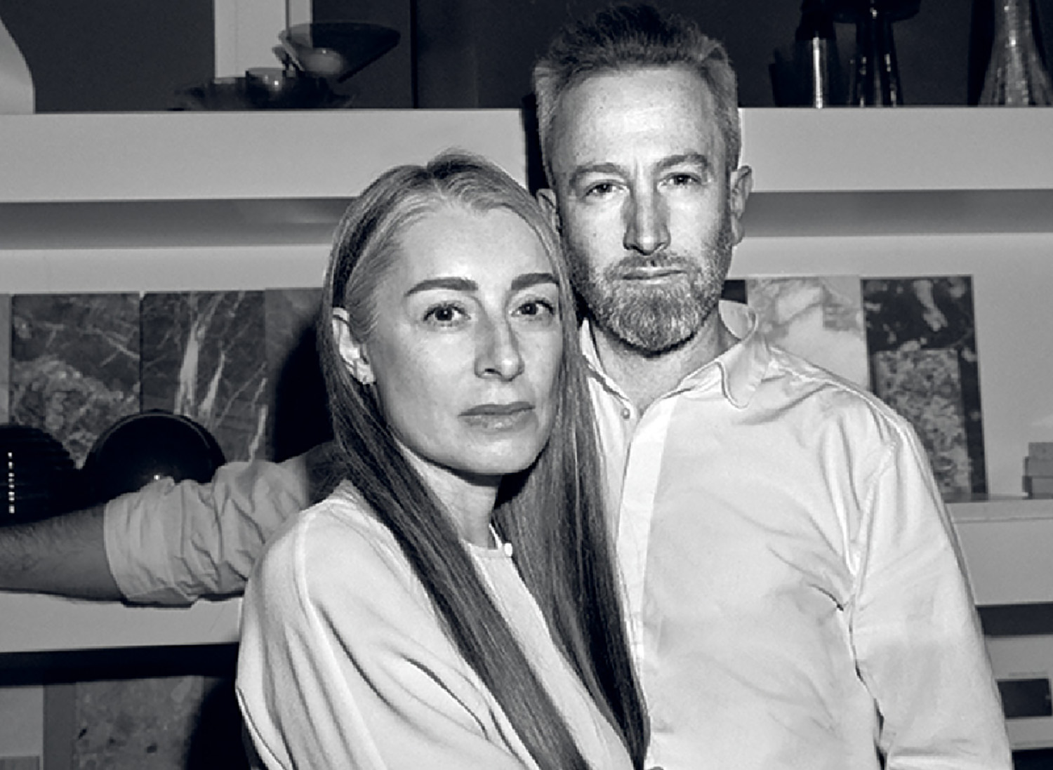 A man and woman sitting on a couch