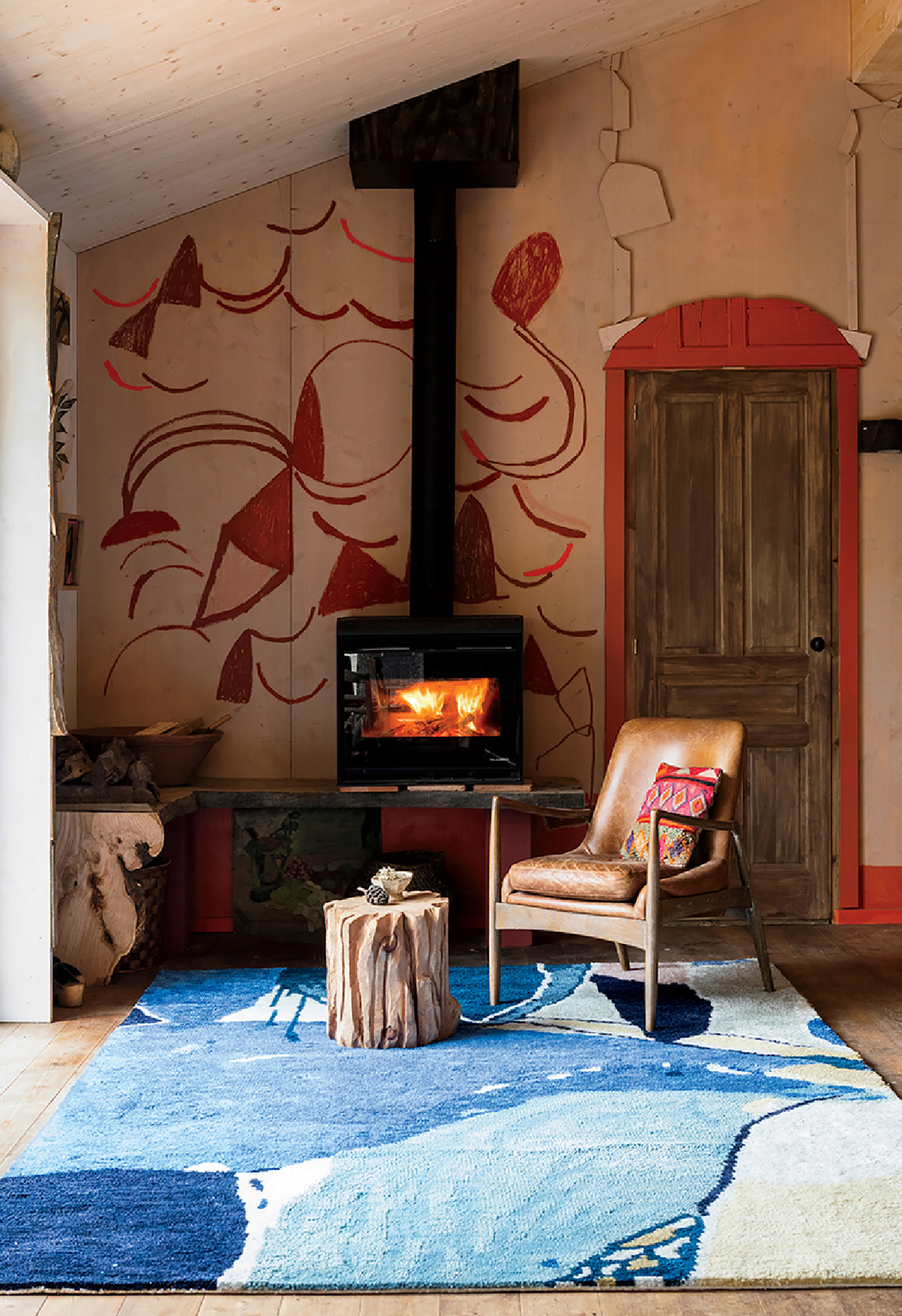 A living room with a fireplace and a chair