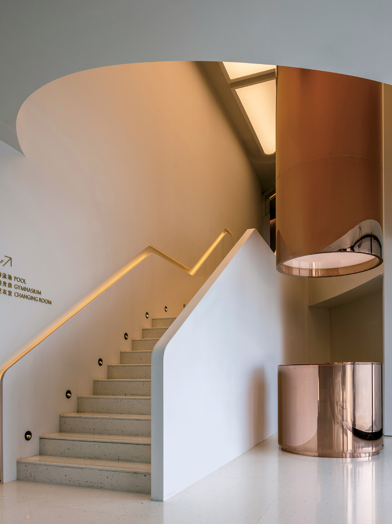 A staircase with a metal handrail and a metal handrail