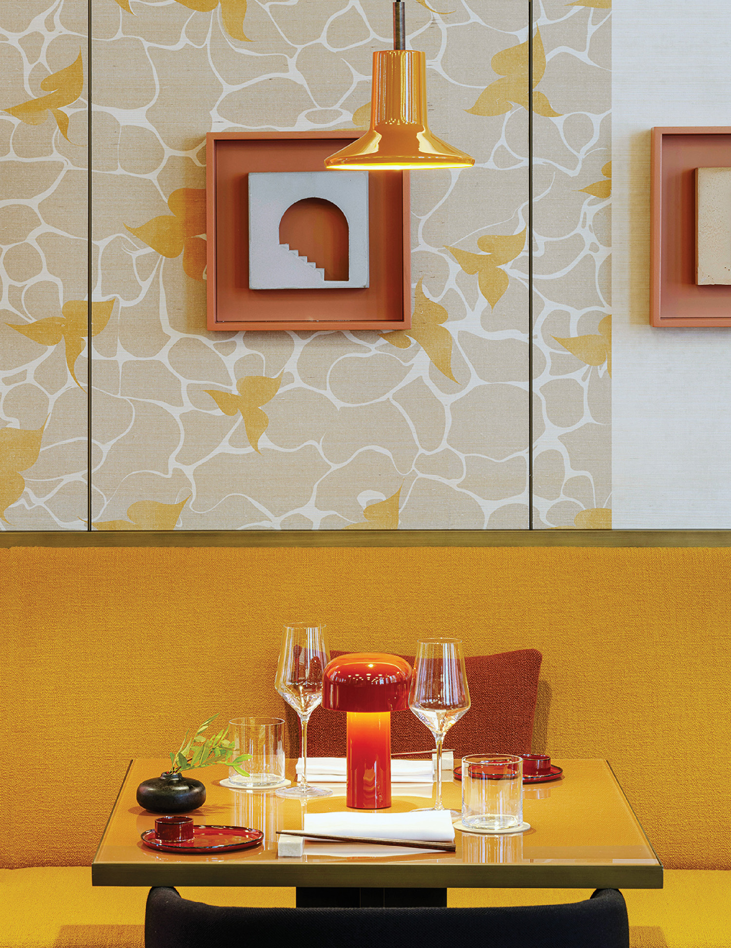 A table with a glass and a plate on it