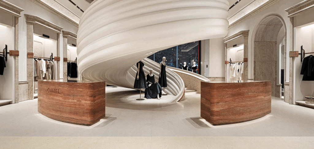 large white staircase behind mannequins