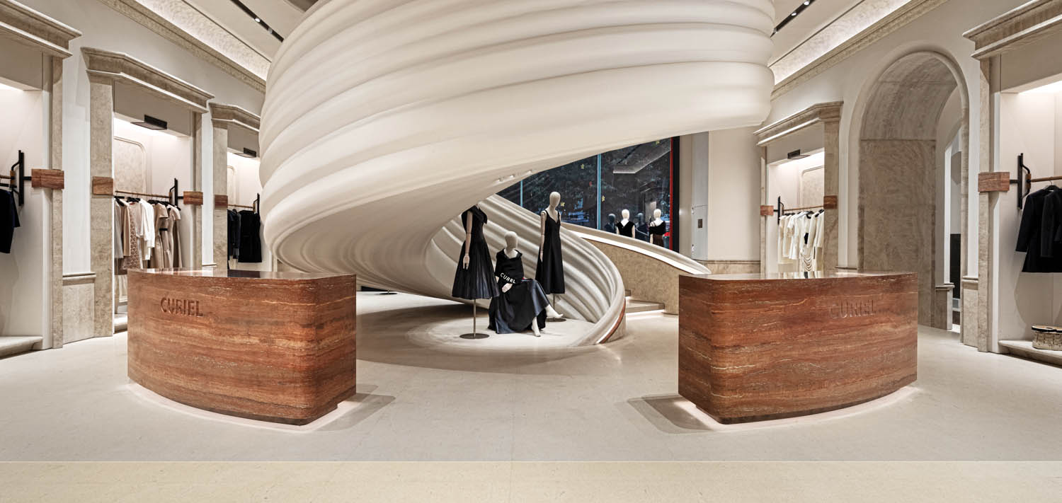 large white staircase behind mannequins