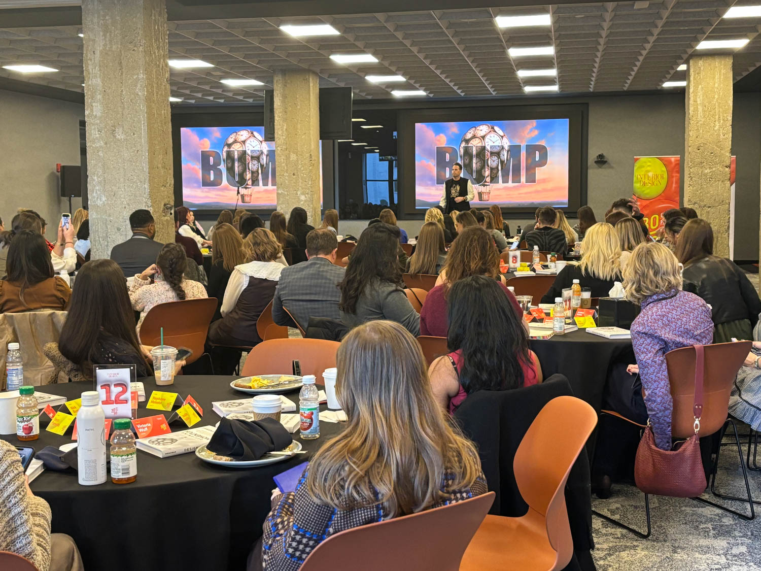 30/30 national conference with young designers in a room