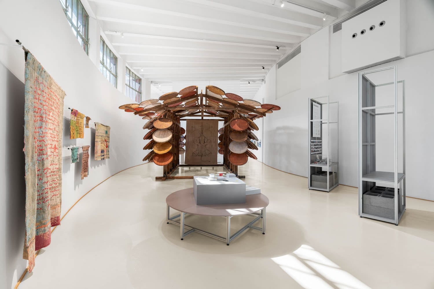 room with sculpture made of round discs