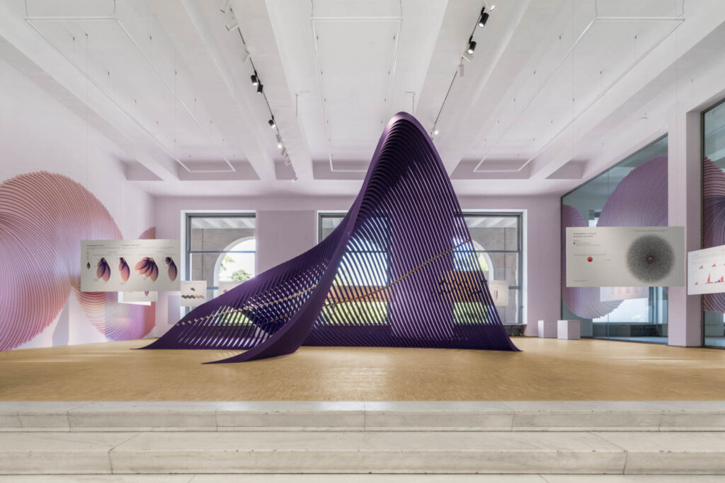 large curvy purple sculpture in room