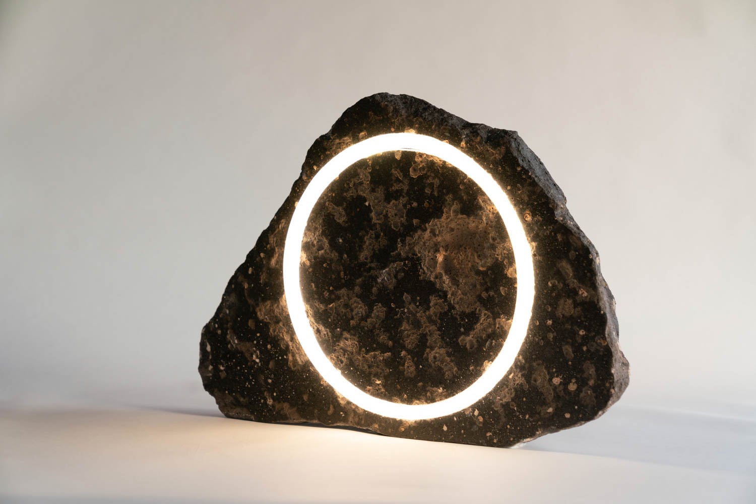 rock sculpture with circular light