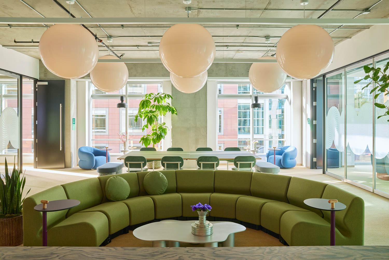 coworking space with curved green sofa
