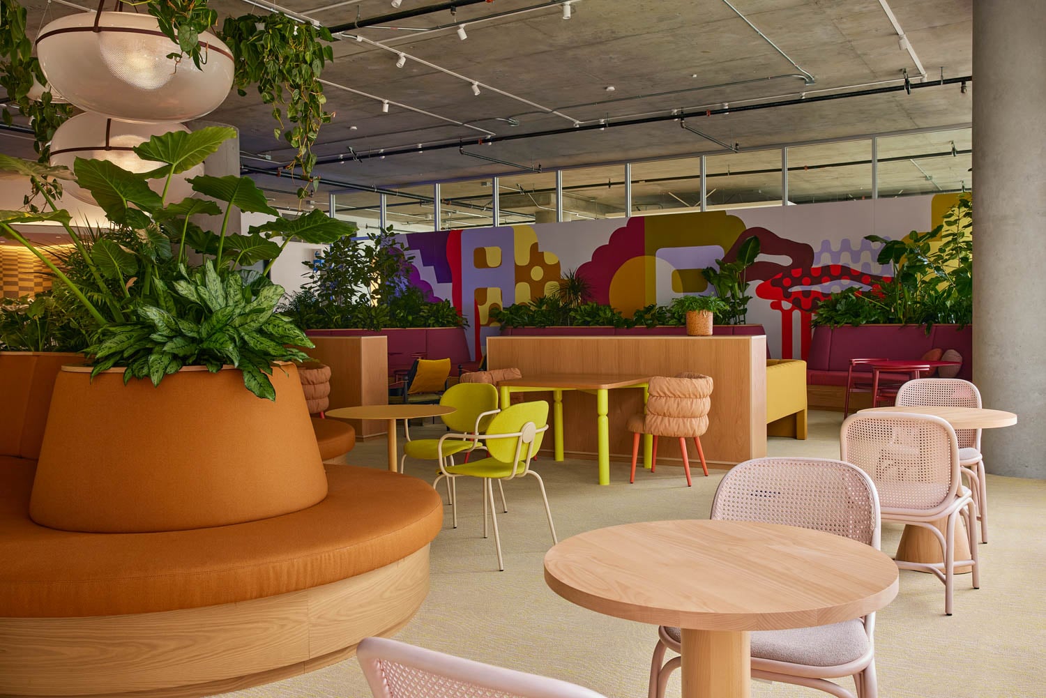 dining area with colorful mural and funky chairs