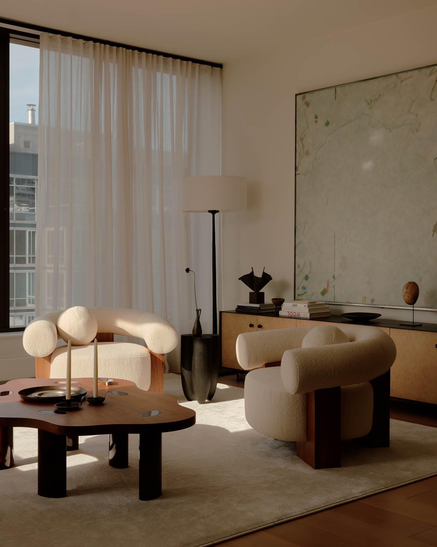 white chairs pair with a wooden cloud table