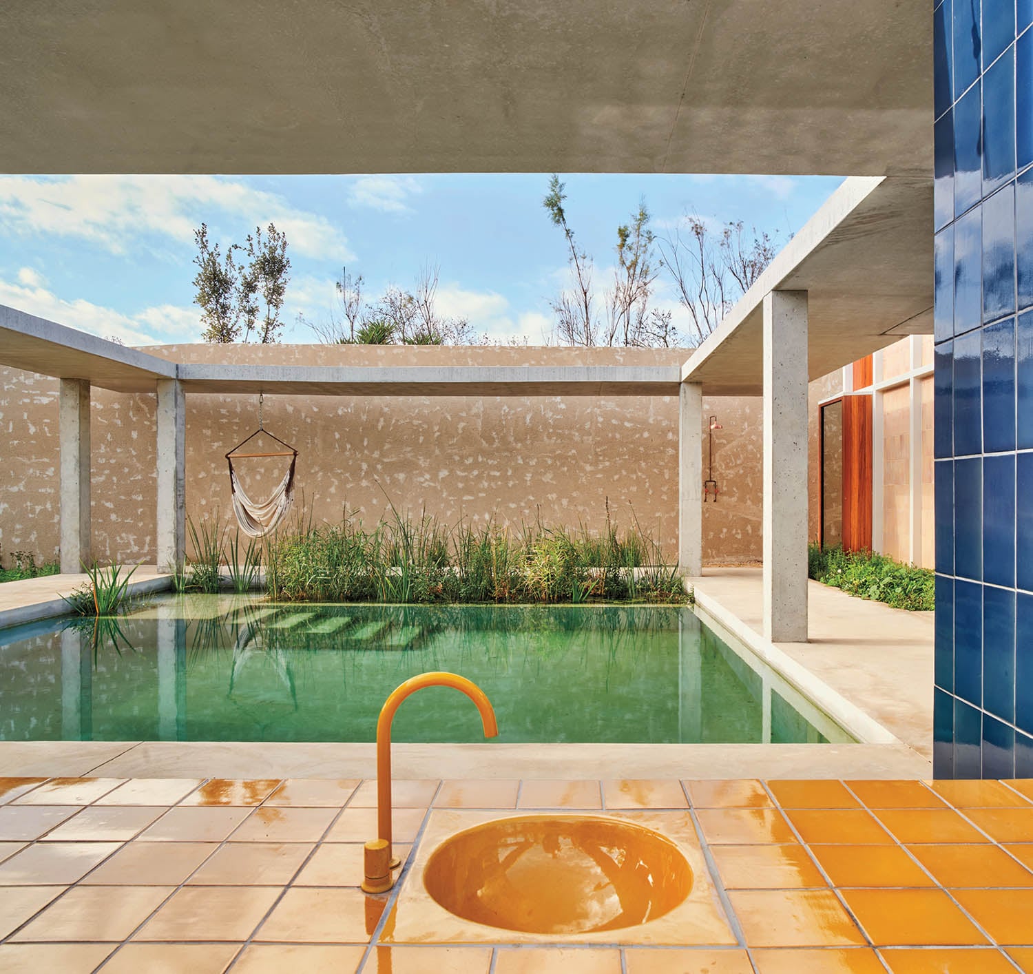 outdoor patio area overlooking pool