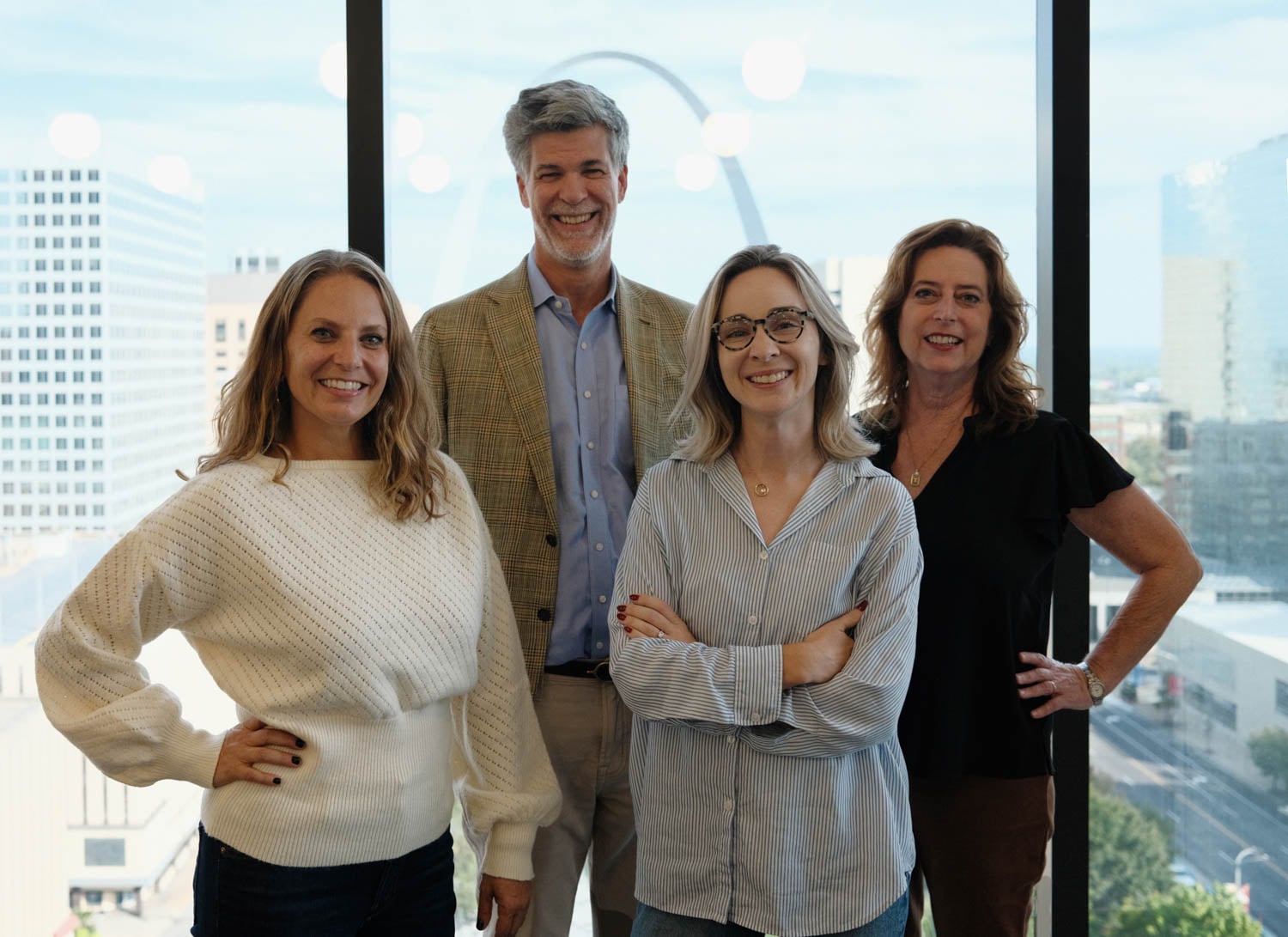 multiple people standing in front of window